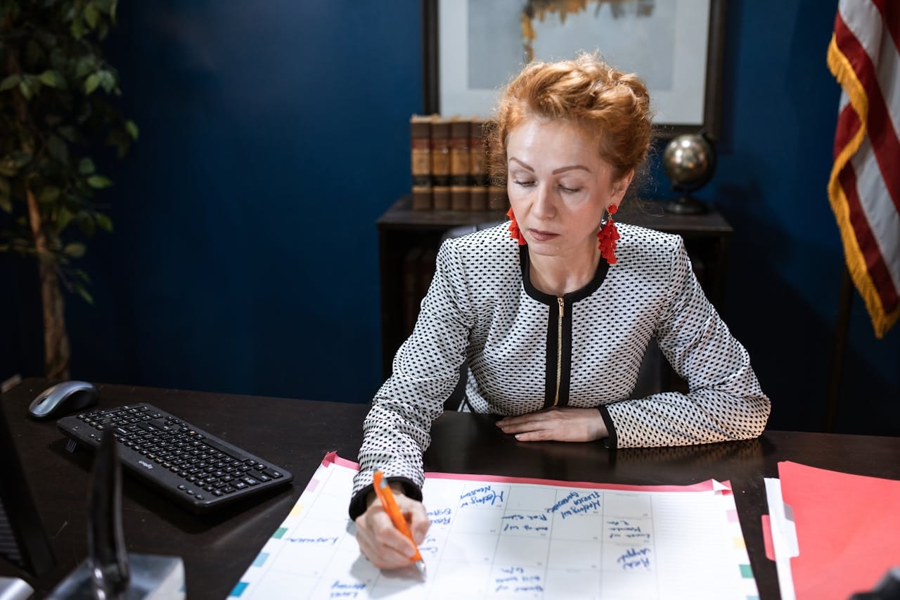 Woman planning schedule at office desk