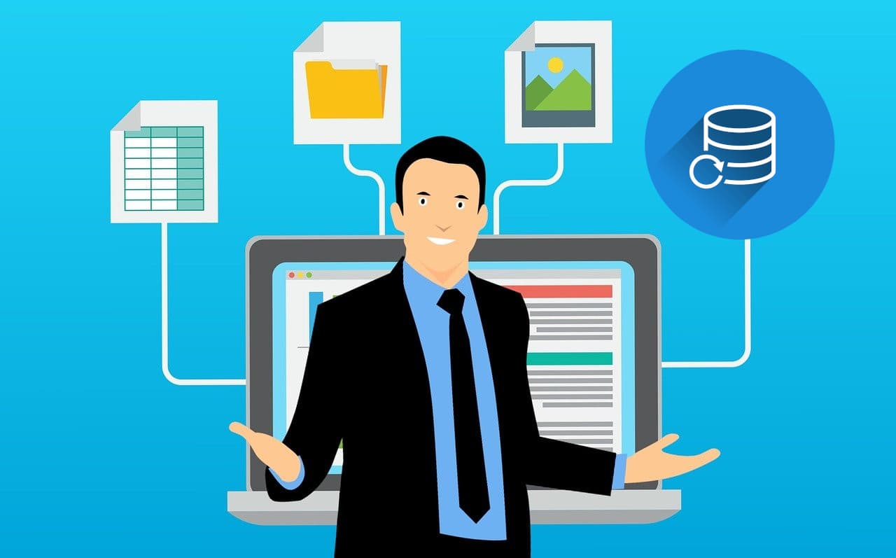 Person organising digital data on laptop screen